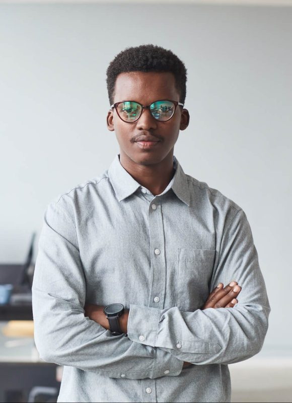 portrait-of-african-american-man-standing-in-offic-2022-01-19-00-08-58-utc-e1658640095264.jpg